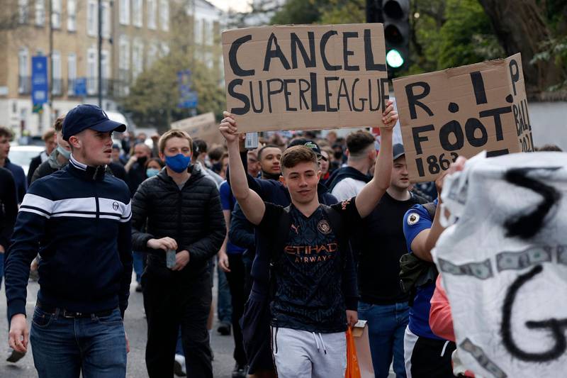 Football supporters demonstrate against the proposed European Super League outside Stamford Bridge on Tuesday, April 20. AFP