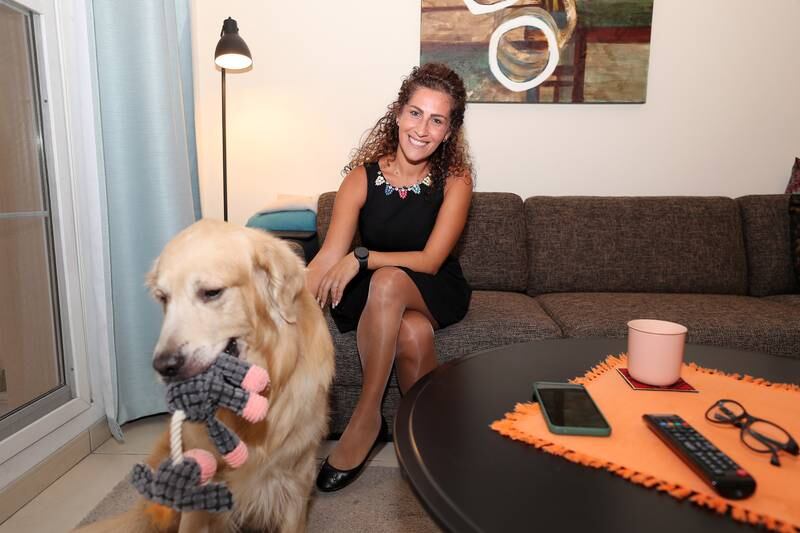 Jessy Chami at home with her golden retriever, Duke. Pawan Singh / The National