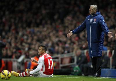 Arsenal Arsene Wenger reacts after a challenge on striker Alexis Sanchez during Arsenal's win over Southampton in the Premier League on Wednesday. Ian Kington / AFP / December 3, 2014  