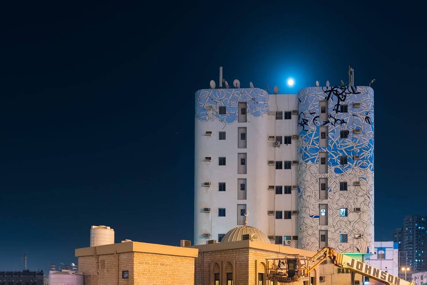 Legibility isn't a priority in El Seed's works (the work pictured is in Ajman). "I want people to reflect on what they are looking at," he told The National earlier this year. "It's super-difficult to read what I write, but if you read Arabic, you will know."