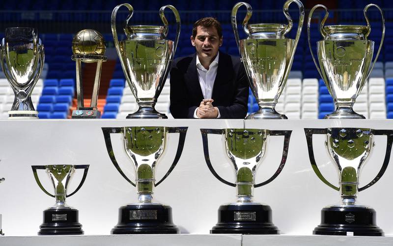 Iker Casillas poses with the trophies he won with Real Madrid after a press conference at the Bernabeu Stadium in 2015. AFP