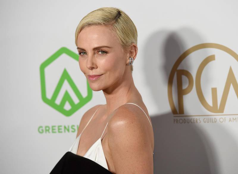 Charlize Theron arrives at the 2020 Producers Guild Awards at the Hollywood Palladium on Saturday, Jan. 18, 2020, in Los Angeles, Calif. (AP Photo/Chris Pizzello)