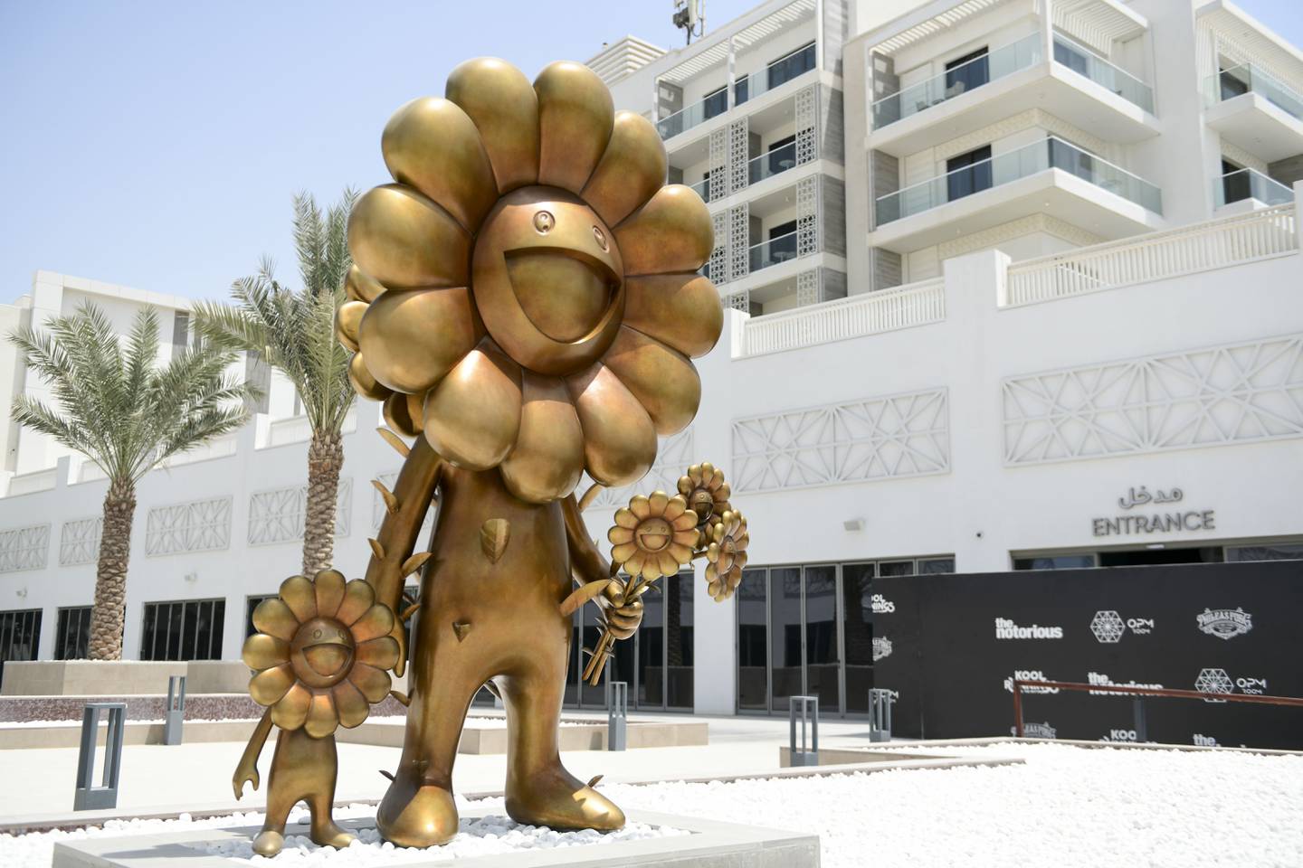 'Flower Parent and Child', a golden sculpture by Takashi Murakami on the waterfront promenade in Yas Bay, Abu Dhabi.  Khushnum Bhandari / The National