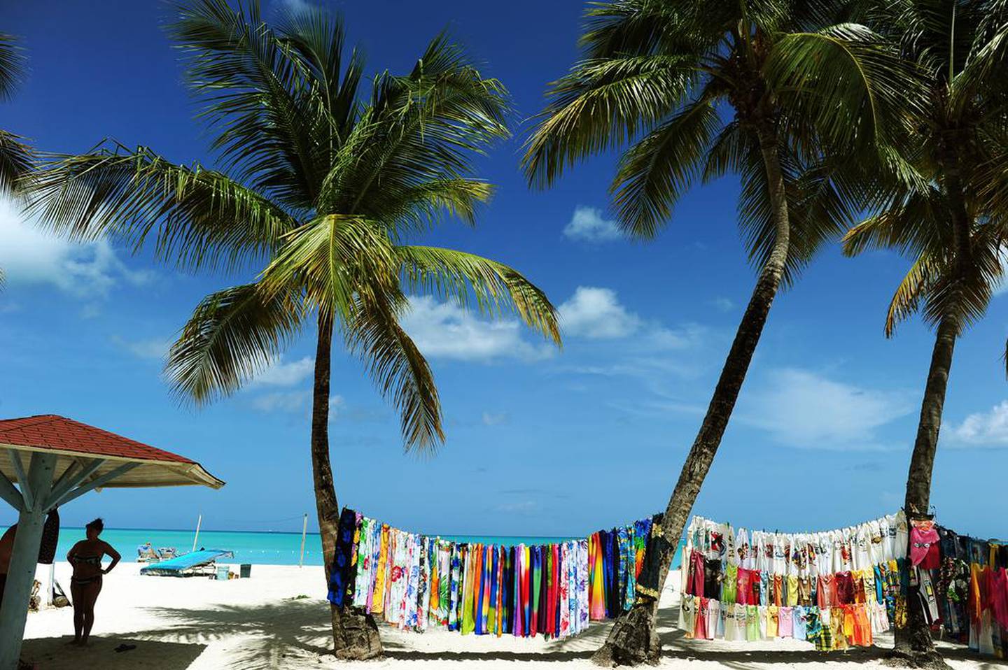 A vendor displays a collection of clothing on a beach in St John's, Antigua and Barbuda. Jewel Samad / AFP 