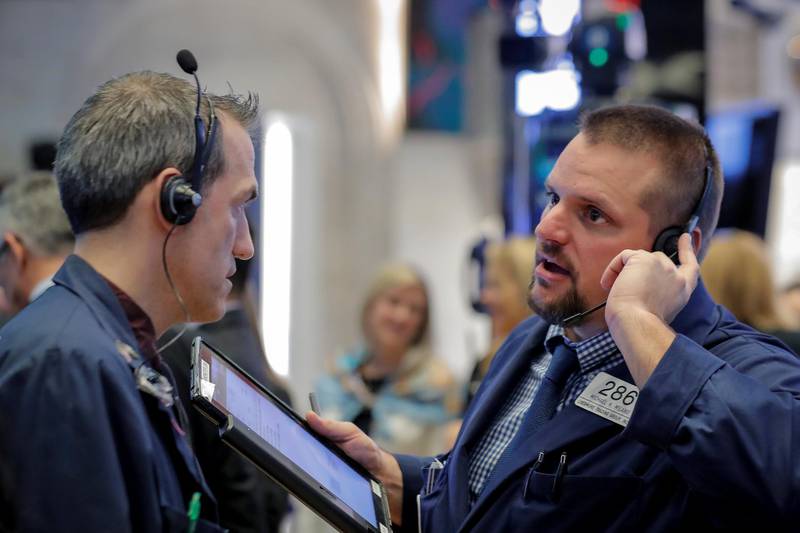 Traders work on the floor of the New York Stock Exchange (NYSE) in New York, U.S., October 16, 2018. REUTERS/Brendan McDermid