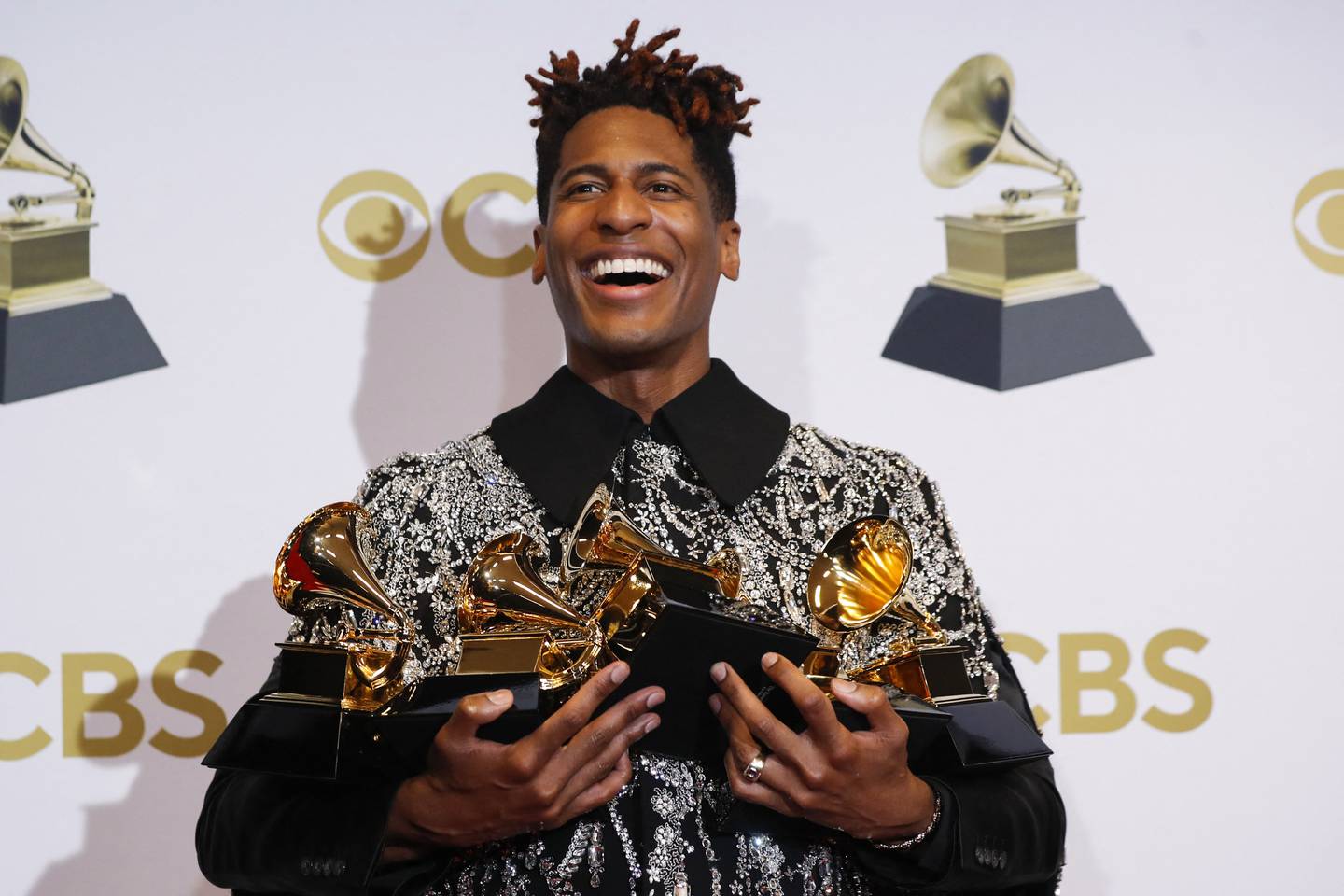 Jon Batiste with his Grammys. Reuters