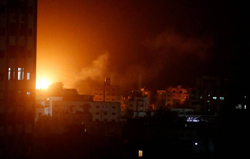 An explosion caused by Israeli airstrikes is seen from Hamas security building in Gaza City, Monday, March 25, 2019. Israeli forces on Monday struck targets across the Gaza Strip in response to a surprise rocket attack from the Palestinian territory, as the military beefed up troops and rocket-defense systems in anticipation of a new round of heavy fighting with the Islamic militant Hamas group. (AP Photo/Adel Hana)