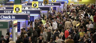 Passengers queue to check-in at Terminal 1 of Heathrow Airport in 2006 during the Christmas and New Year period.