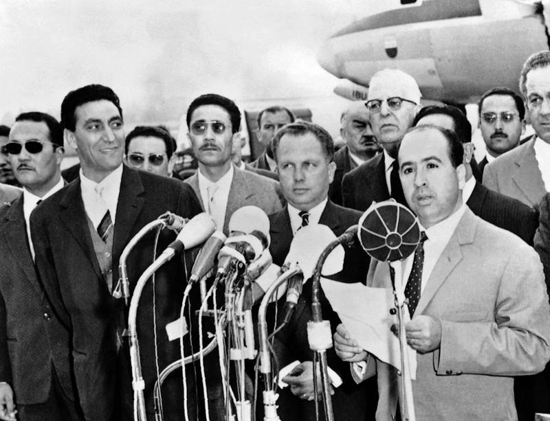 Belkacem Krim, the then vice president of the Provisional Government of the Algerian Republic, alongside Taieb Boulharouf, another delegate, arrive in Geneva for talks that eventually led to the Evian accords. AFP