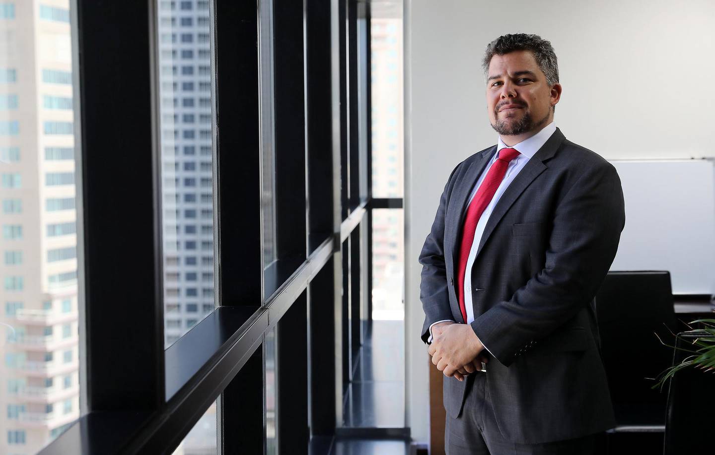 DUBAI,  UNITED ARAB EMIRATES , April 23 – 2019 :- Andrew Morris Partner at Banks Legal, a UAE legal consulting firm at his office in the JBC 4 at Jumeirah Lakes Towers in Dubai. ( Pawan Singh / The National ) For Business. Story by Nada El Sawy