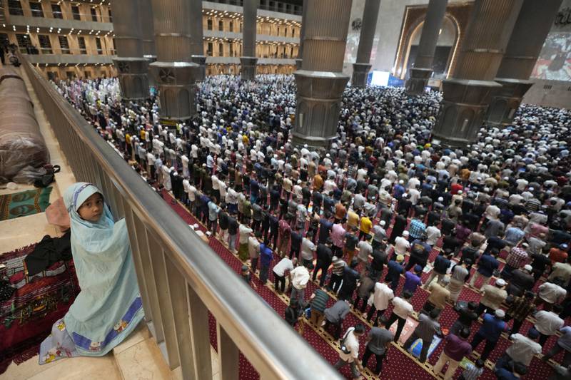 A young girl enjoys a great view of evening prayer at Istiqlal Mosque in Jakarta, Indonesia. AP