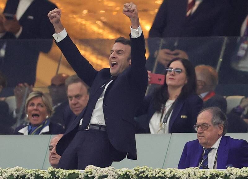 French President Emmanuel Macron (C) celebrates after the final whistle of the FIFA World Cup 2022 semi final between France and Morocco at Al Bayt Stadium in Al Khor, Qatar, 14 December 2022.   EPA / Friedemann Vogel