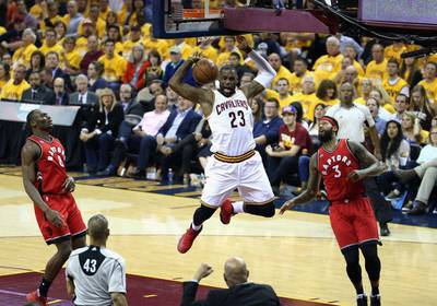 LeBron James of the Cleveland Cavaliers dunks the ball against the Toronto Raptors on Thursday night. Andy Lyons / Getty Images / AFP / May 19, 2016