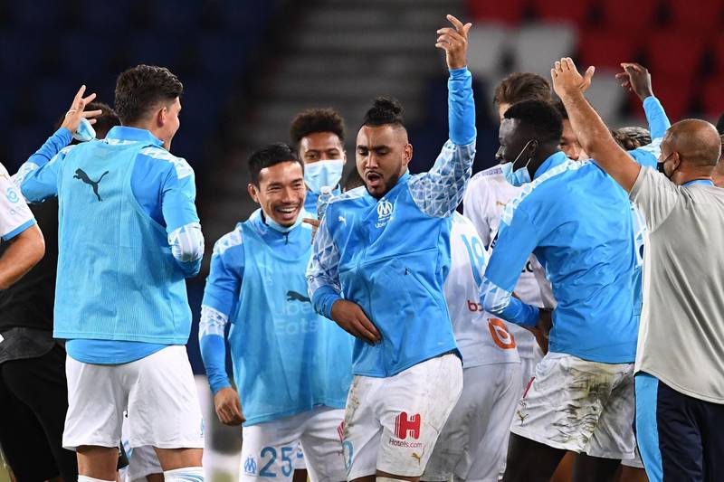 Marseille's French midfielder Dimitri Payet dances with teammates. AFP