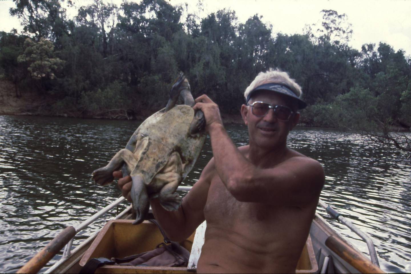 John Cann poses with an adult Mary River turtle. Suplied by John Cann