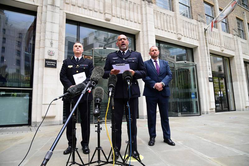City of London Police Assistant Commissioner Alistair Sutherland, left, and Assistant Commissioner Neil Basu, the national lead for Counter Terrorism Policing, speak to the media alongside Detective Chief Inspector Dan Brown, right, speak outside the Guildhall, London, Friday, May 28, 2021. A string of failures by British authorities played a part in allowing an extremist who had been jailed for terrorism offenses kill two people in a knife attack in London, an inquest jury concluded Friday.  Usman Khan struck during a prisoner rehabilitation event he was attending at Fishmongersâ€™ Hall in November 2019, killing two people and wounding three before he was chased onto nearby London Bridge and shot dead by police. (Ian West/PA via AP)