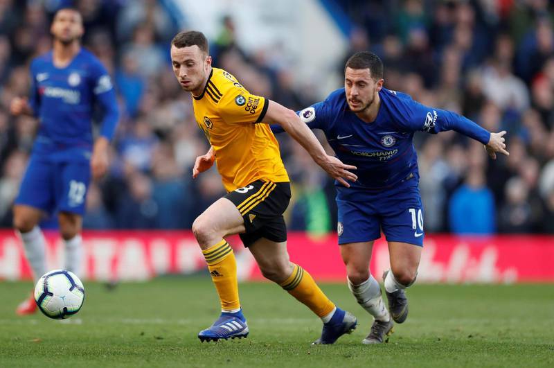 Soccer Football - Premier League - Chelsea v Wolverhampton Wanderers - Stamford Bridge, London, Britain - March 10, 2019  Wolverhampton Wanderers' Diogo Jota in action with Chelsea's Eden Hazard   Action Images via Reuters/Matthew Childs  EDITORIAL USE ONLY. No use with unauthorized audio, video, data, fixture lists, club/league logos or "live" services. Online in-match use limited to 75 images, no video emulation. No use in betting, games or single club/league/player publications.  Please contact your account representative for further details.