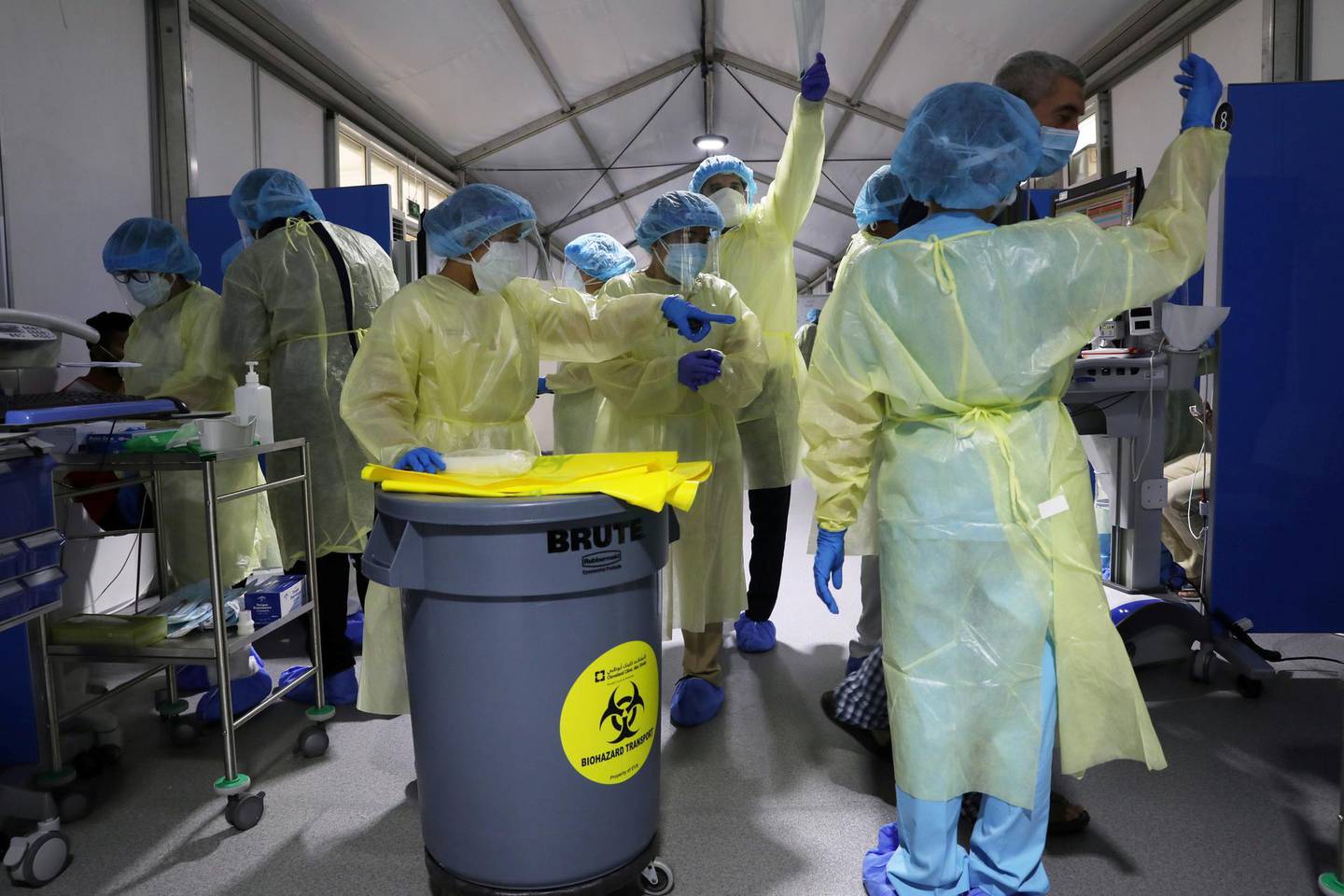 Members of medical staff wearing protective equipment work during testing, amid the coronavirus disease (COVID-19) outbreak, at the Cleveland Clinic hospital in Abu Dhabi, United Arab Emirates, April 20, 2020. Picture taken April 20, 2020. REUTERS/Christopher Pike