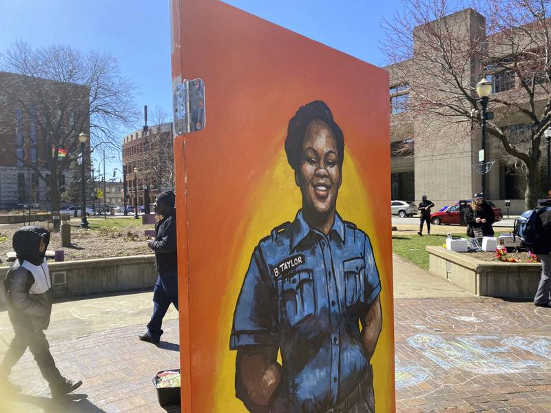 A painting of Taylor is among the art pieces decorating Jefferson Square Park in Louisville. AP