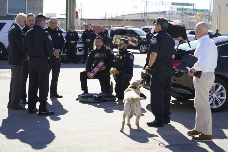 Mr Biden watches as border officers demonstrate how they search vehicles for drugs, money and other contraband. AP