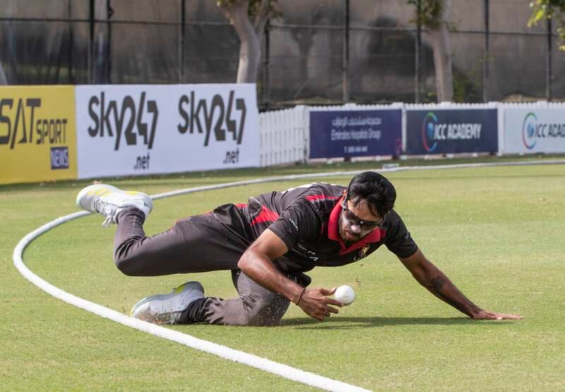 UAE player Chirag Suri attempts to save a boundary during the Cricket World Cup League 2 match at the ICC Academy in Dubai. 