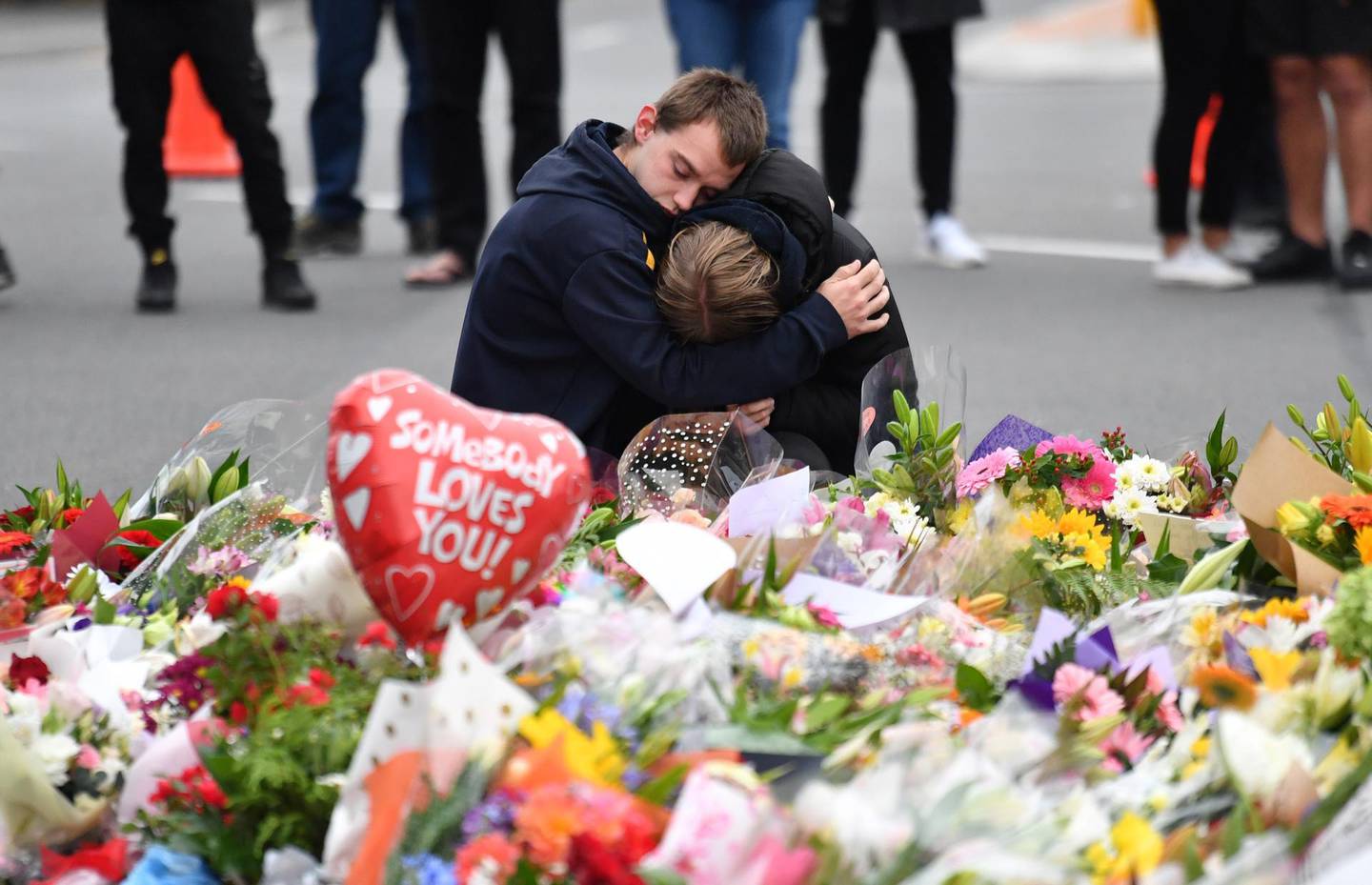 epaselect epa07441388 Members of the public mourn at a flower memorial near the Al Noor Masjid on Deans Rd in Christchurch, New Zealand, 16 March 2019. A gunman killed 49 worshippers at the Al Noor Masjid and Linwood Masjid on 15 March. The 28-year-old Australian suspect, Brenton Tarrant, appeared in court on 16 March and was charged with murder.  EPA/MICK TSIKAS  AUSTRALIA AND NEW ZEALAND OUT