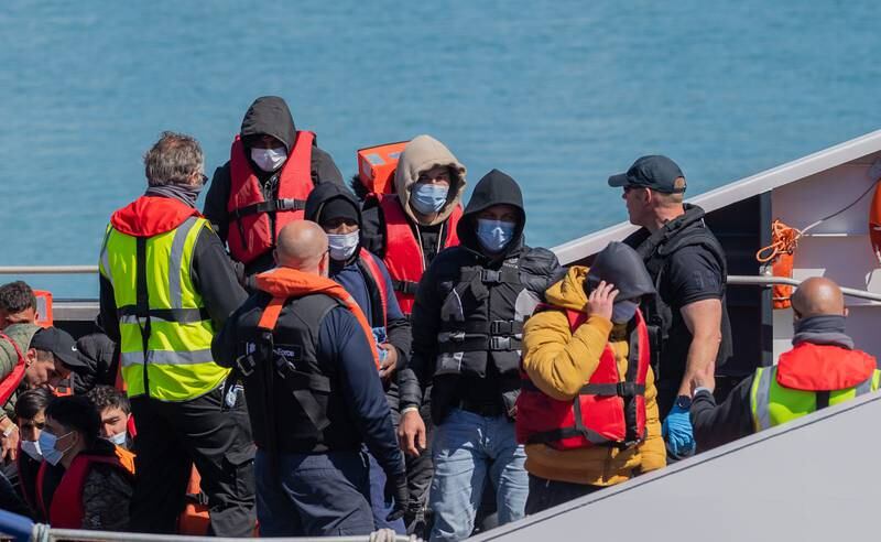 The UK Border Force brings people ashore at Dover Harbour who were attempting to get to Britain in four boats. EPA