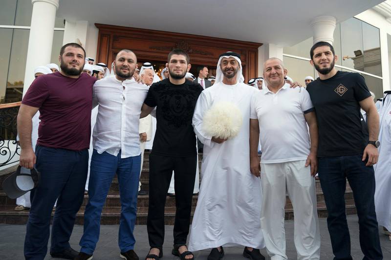 ABU DHABI, UNITED ARAB EMIRATES - September 09, 2019: HH Sheikh Mohamed bin Zayed Al Nahyan, Crown Prince of Abu Dhabi and Deputy Supreme Commander of the UAE Armed Forces (3rd R), stands for a photo with Khabib Nurmagomedov, UFC Lightweight Champion and winner of UFC 242 Abu Dhabi (4th R), during a Sea Palace barza. Seen holding a traditional 'Papakha' hat, a gift from Khabib Nurmagomedov. 

( Hamad Al Kaabi / Ministry of Presidential Affairs )​
---