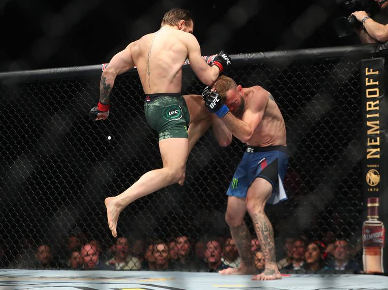 Conor McGregor moves in for a knee hit against Donald Cerrone. Reuters
