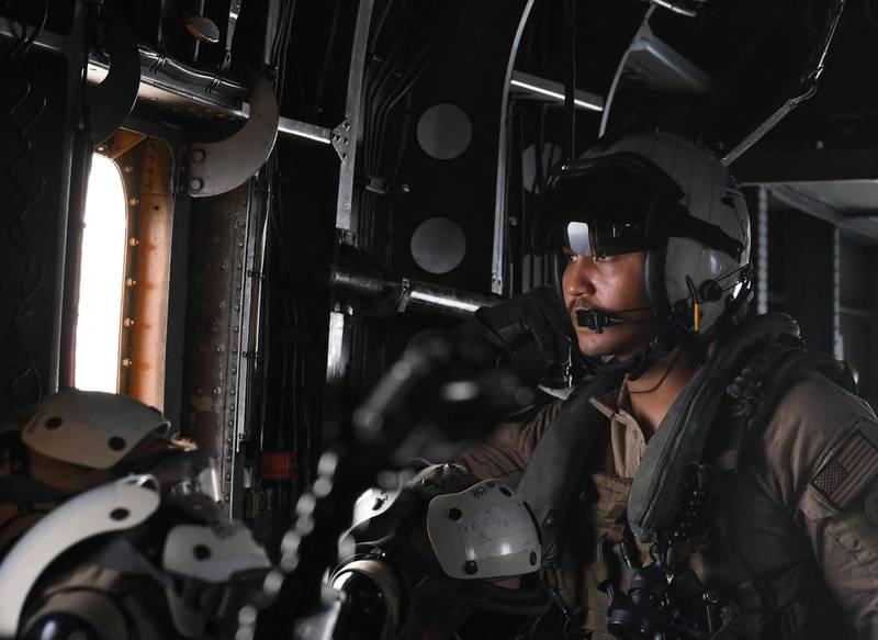 A US soldier on board a Black Hawk helicopter reconnaissance flight looks on during the International Maritime Exercise in the Gulf waters off Bahrain. AFP