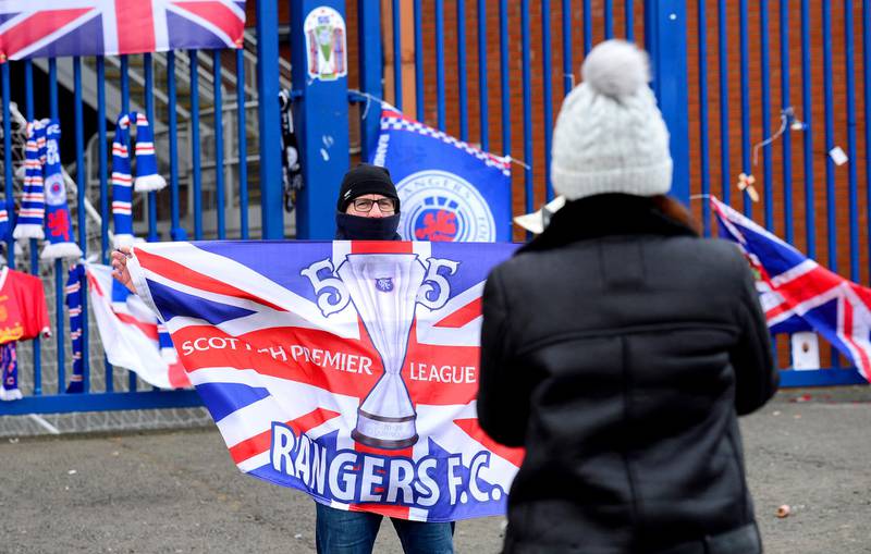 Rangers fans gather outside the Ibrox Stadium to celebrate their team winning the 2021 Scottish Premiership title.