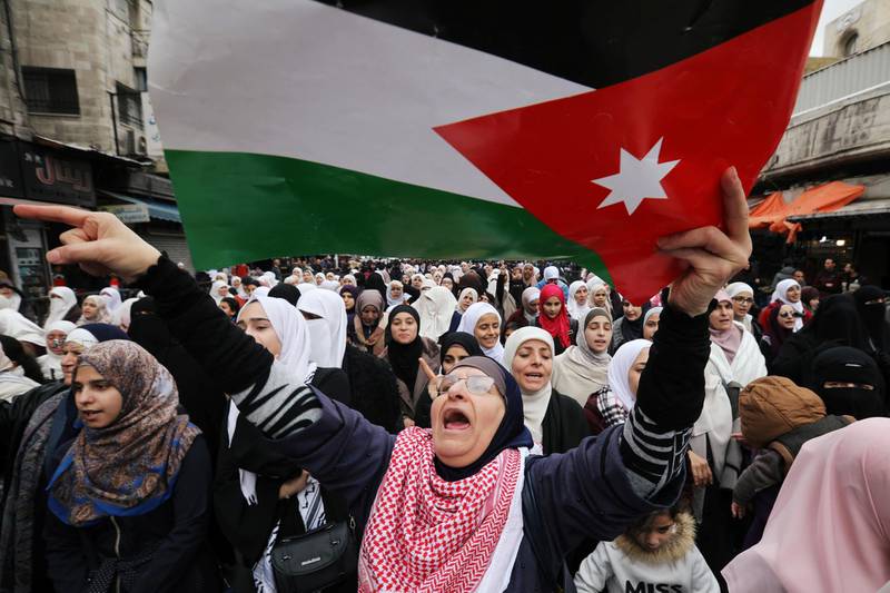 Demonstrators hold Jordanian national flags and chant slogans during a protest against a government's agreement to import natural gas from Israel, in Amman, Jordan. REUTERS