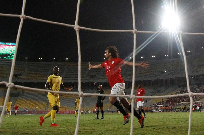 Egypt's Amr Warda celebrates their third goal, scored by Omar Gaber. Reuters