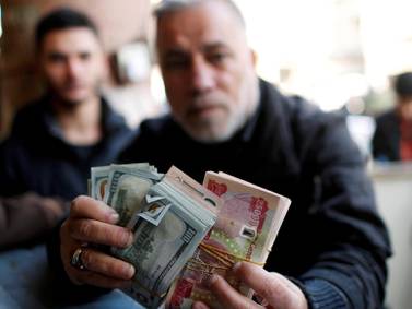 Iraq to restrict all internal trade to dinars from next year