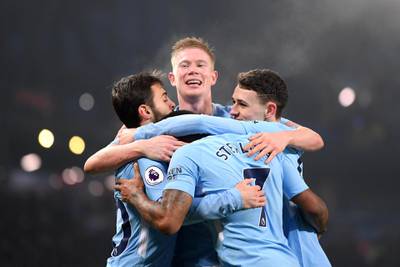 MANCHESTER, ENGLAND - DECEMBER 16:  Raheem Sterling of Manchester City celebrates after scoring his sides fourth goal with Kevin De Bruyne of Manchester City, Phil Foden of Manchester City, Bernardo Silva of Manchester City during the Premier League match between Manchester City and Tottenham Hotspur at Etihad Stadium on December 16, 2017 in Manchester, England.  (Photo by Laurence Griffiths/Getty Images)