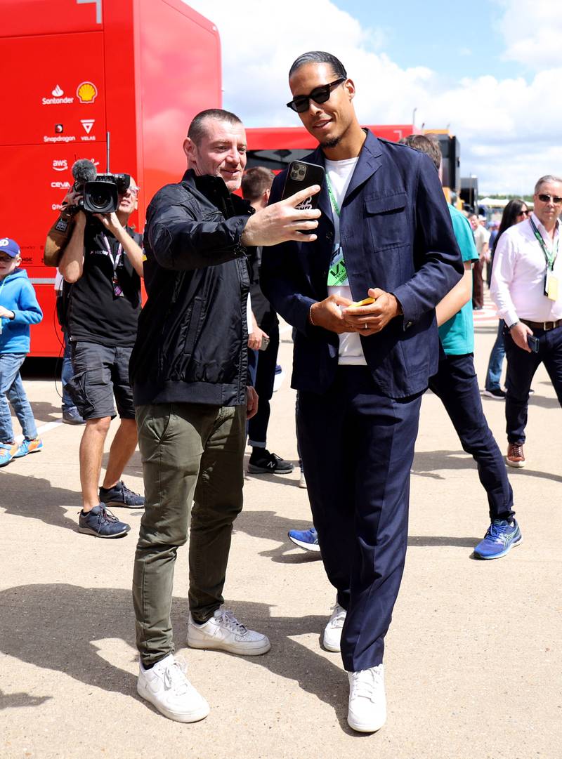 Liverpool's Virgil van Dijk poses for a picture with a fan. Reuters