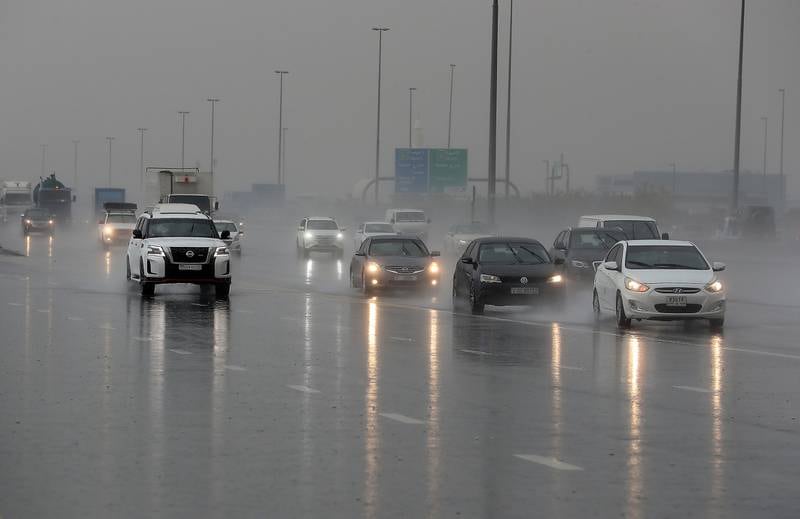 Motorists drive in the rain on Al Khail Road in Dubai on Jan 3. All photos: Pawan Singh / The National