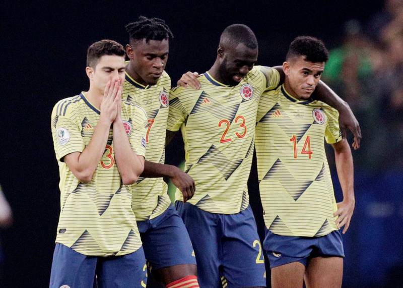Colombia players after losing the penalty shootout. Reuters