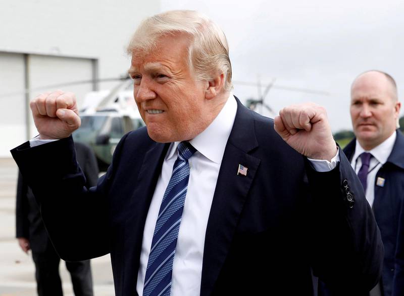 U.S. President Donald Trump gestures after arriving at John Murtha Johnstown-Cambria County Airport in Johnstown after arriving in Pennsylvania to take part in the 17th annual September 11 observance at the Flight 93 National Memorial in Somerset County, Pennsylvania, U.S., September 11, 2018. Reuters photographer Kevin Lamarque: "Celebratory fist pumps on a national day of mourning and reflection caught even the most seasoned of us off guard." REUTERS/Kevin Lamarque  SEARCH "TRUMP POY" FOR FOR THIS STORY. SEARCH "REUTERS POY" FOR ALL BEST OF 2018 PACKAGES. TPX IMAGES OF THE DAY.