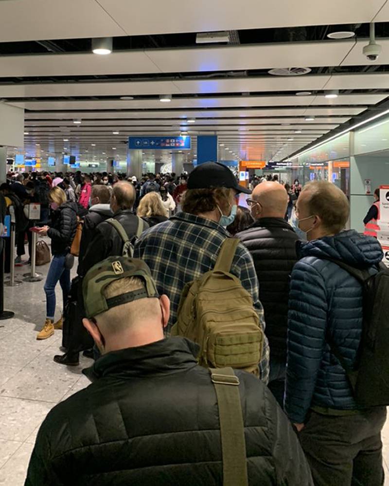 Picture take with permission from the twitter feed of @ChristianDJones of passengers queuing for the Arrival Hall at London Heathrow Airport's Terminal 5, due to a problem with the self-service passport gates.