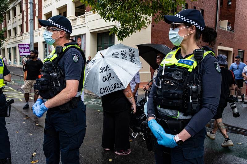 Anti-vaccination protesters gather outside the Park Hotel in Melbourne. Getty Images
