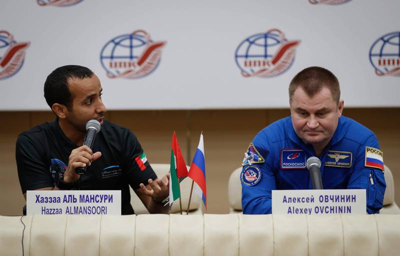 epa07906975 United Arab Emirates astronaut Hazzaa Ali Almansoori (L) and Russian cosmonaut Alexey Ovchinin attend a news conference at the Gagarin Cosmonaut Training Center in Star City outside Moscow, Russia,  09 October 2019. Russian Soyuz MS-12 space capsule with U.S. astronaut Nick Hague, Russian cosmonaut Alexey Ovchinin and United Arab Emirates astronaut Hazzaa Ali Almansoori, returned from a mission to the International Space Station landed safely in the steppes of Kazakhstan at 03 October.  EPA/YURI KOCHETKOV