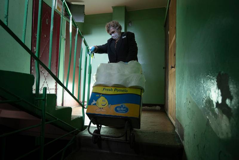 Galina Yakovleva makes deliveries every day of goods donated by shops, restaurants and even theatres. AP Photo