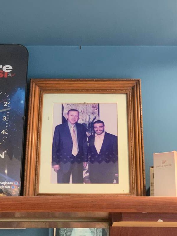 Inside the barber shop is a picture of Mr Ayhan and Mr Erdogan from 2012, when the latter was Prime Minister. Jamie Prentis / The National