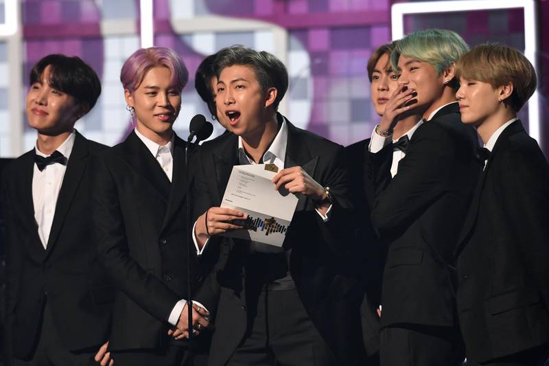 South Korean band BTS presents the award for Best R&B Album during the 61st Annual Grammy Awards on February 10, 2019, in Los Angeles.  / AFP / Robyn Beck
