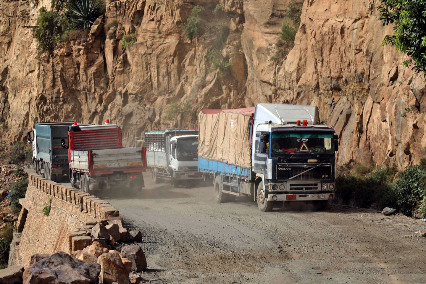 Vehicles on a heavily damaged road, the only route between Taiz and Aden. AFP