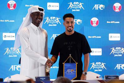 Qatar's forward Almoez Ali, left, and Saudi Arabia's forward Salem al-Dawsari at a press conference on the eve of the AFC Annual Awards. AFP