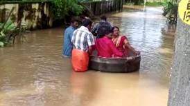 Kerala floods: couple floats to wedding in giant cooking pot
