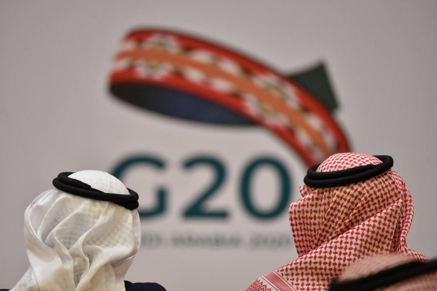 Unidentified guests attend a meeting of Finance ministers and central bank governors of the G20 nations in the Saudi capital Riyadh on February 23, 2020. The deadly coronavirus epidemic will dent global growth, the IMF warned, as G20 finance ministers and central bank governors weighed its economic ripple effects at a two-day gathering in Riyadh. / AFP / FAYEZ NURELDINE
