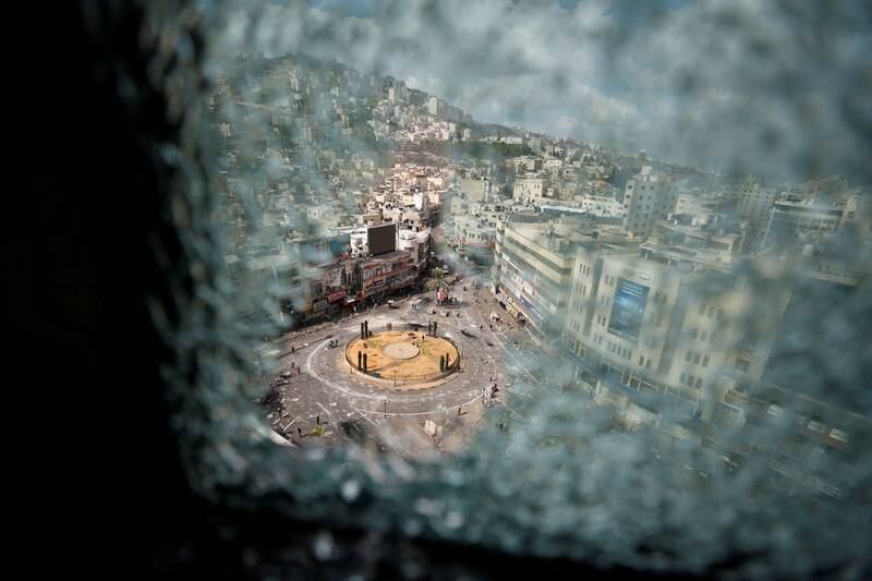 A roundabout from a damaged window after clashes between Palestinian security forces and gunmen over the arrest of two Palestinian militants, in Nablus in the Israeli-occupied West Bank. Reuters